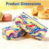 A yellow and purple squishy butter stress relief toy is shown next to a croissant.