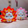 A set of building blocks shaped like a fiery orange fox and a white, pink fox.