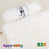 A roll of white fluffy faux fur yarn labeled Snow Fox with a wooden stick visible.