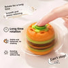 A hand rotates an orange burger-shaped silicone spinner toy for stress relief and long time rotation.