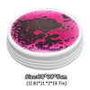 A round, pink and black LED balance stone mat for kids with a white container.