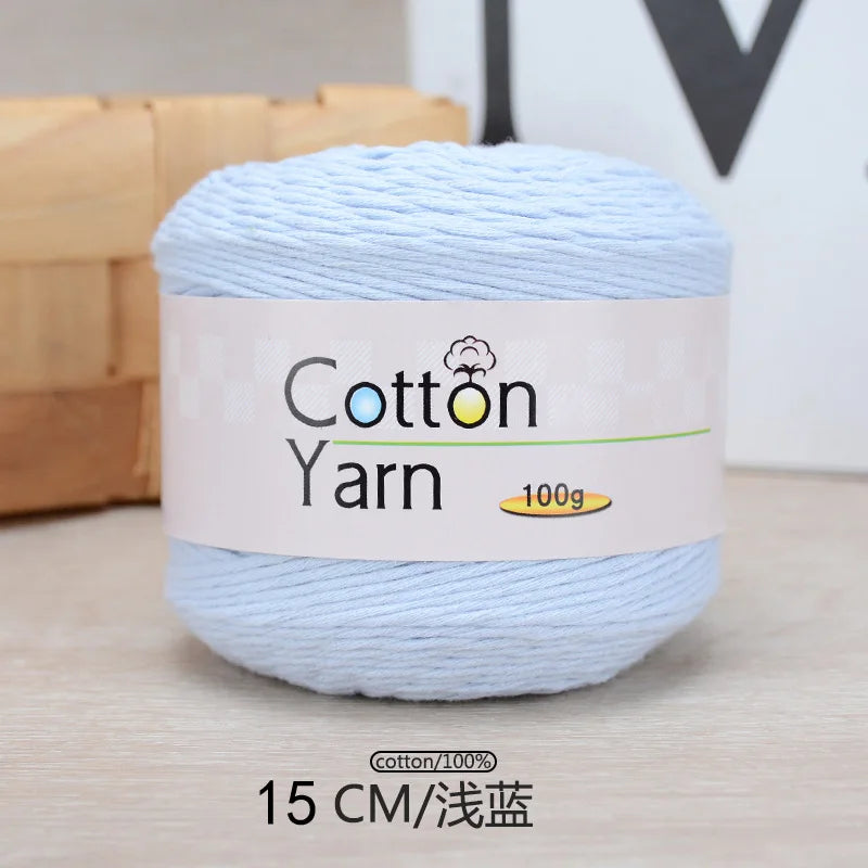 A ball of light blue 100% cotton yarn labeled as Cotton Yarn, measuring 15 cm.