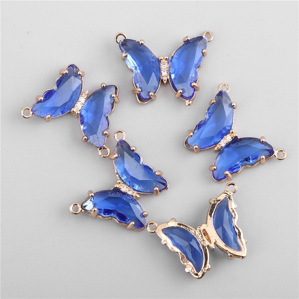 A set of gold-toned crystal butterfly charm beads for jewelry making