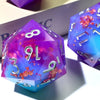 A handmade resin D20 die with a large blue and purple liquid swirl, featuring silver numbers and glitter accents.