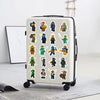 A white portable suitcase features a pack of cartoon ninja stickers and decals on its surface.