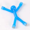 A bright blue magnetic humanoid toy with multiple limbs and a spherical head.