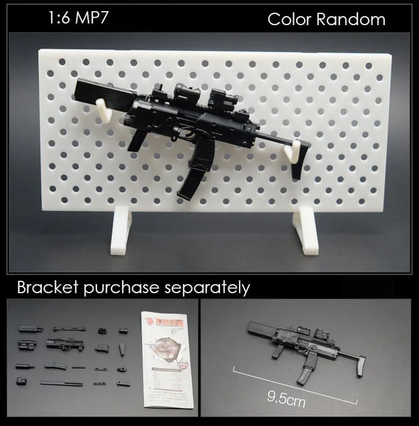 A black 1:6 scale military submachine gun model kit is displayed on a white grid, with separate brackets and scale reference.