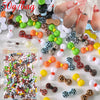 A close-up of various multicolor resin nail charms, including beads and shapes, arranged on a white surface.
