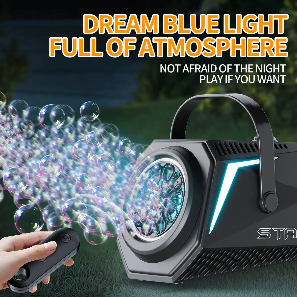 A hand operates a black rechargeable bubble machine with a remote control, creating blue light bubbles outdoors.