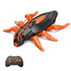 An orange and black wall-climbing RC gecko toy with glowing eyes is shown next to its controller.