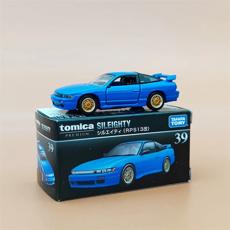 A blue Tomica Sileighty die-cast sports car model in its packaging box.