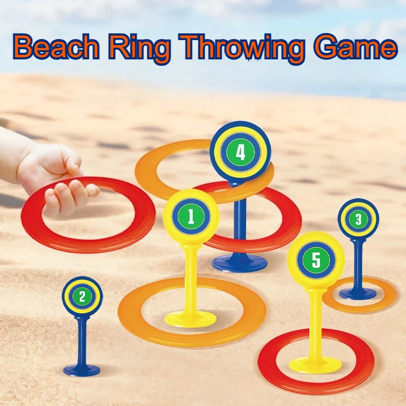 A set of five colored rings and stakes for a beach ring throwing game on sand.