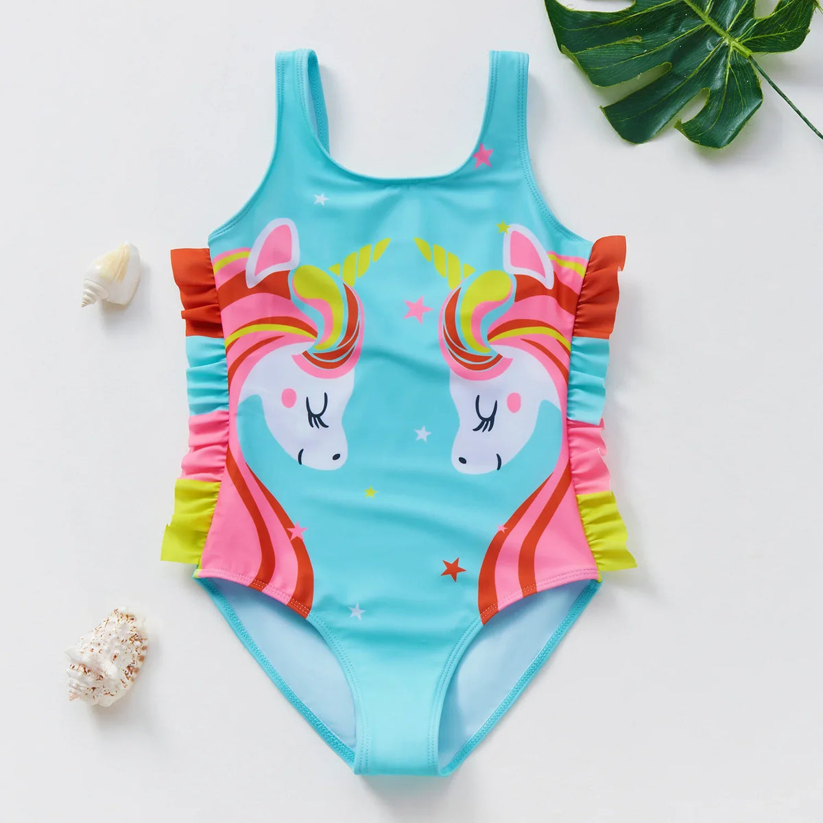 A turquoise one-piece swimsuit for a child featuring a unicorn design with pink and yellow accents.