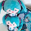 A cute teal plush doll of Hatsune Miku with black and pink accents.