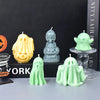 A collection of silicone ghost molds in yellow and green colors for Halloween candles and DIY crafts.