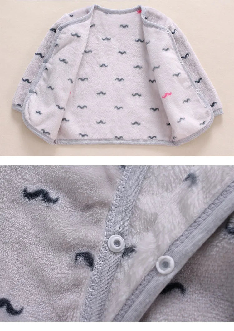 A light gray fleece jacket with a subtle gray mustache print and matching pants.