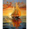 A sailboat with golden sails is reflected on the water against a vibrant orange and yellow sunset sky.