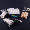 A collection of pre-waxed cotton candle wicks with metal sustainers, including various sizes and a spool.