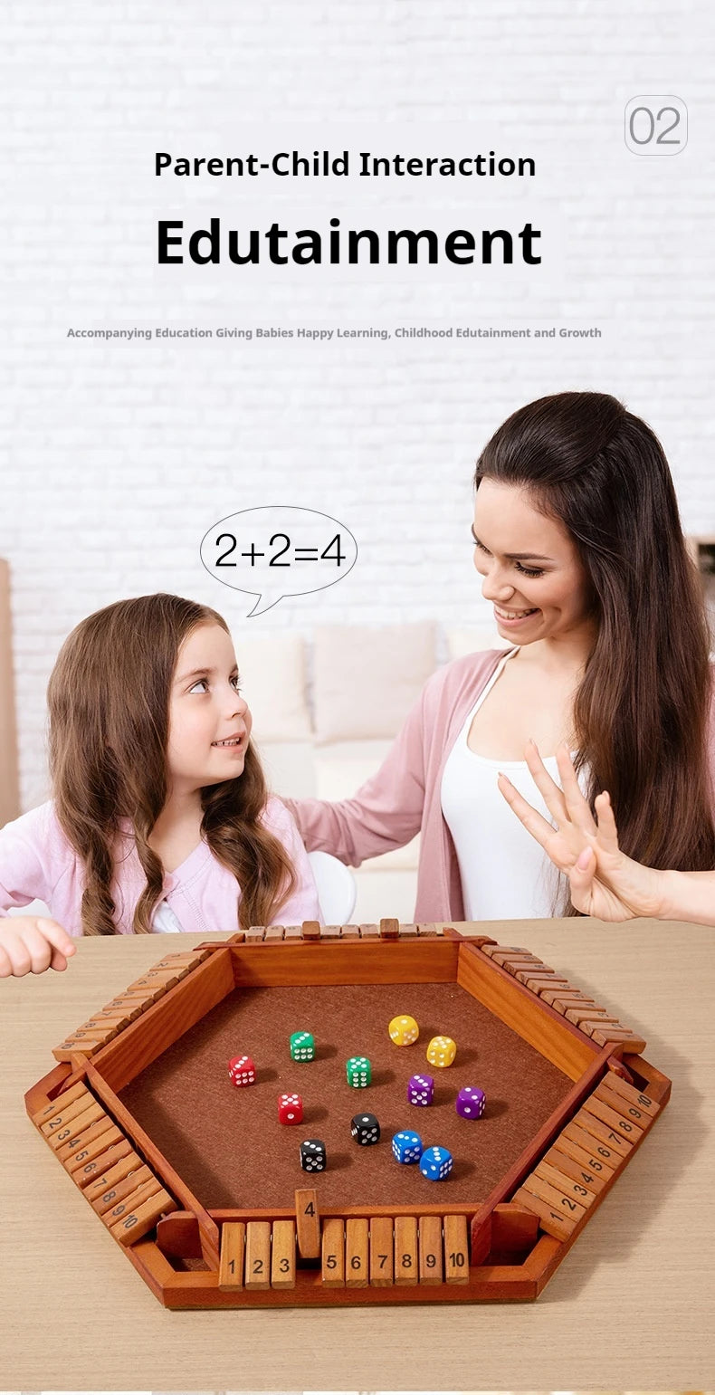 A girl and a woman interact with a wooden dice game on a table.