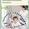 A woman is shown interacting with a baby inside a multi-faceted training mat that includes a fitness frame and hanging toys.