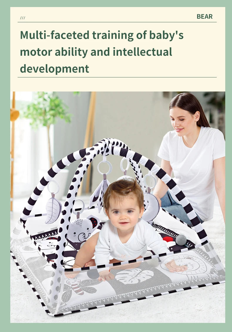 A woman is shown interacting with a baby inside a multi-faceted training mat that includes a fitness frame and hanging toys.