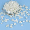 A pile of clear and iridescent acrylic beads in various shapes and sizes for DIY jewelry making