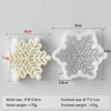 A white silicone mold shaped like a snowflake, showing both the mold and the finished product size and weight.