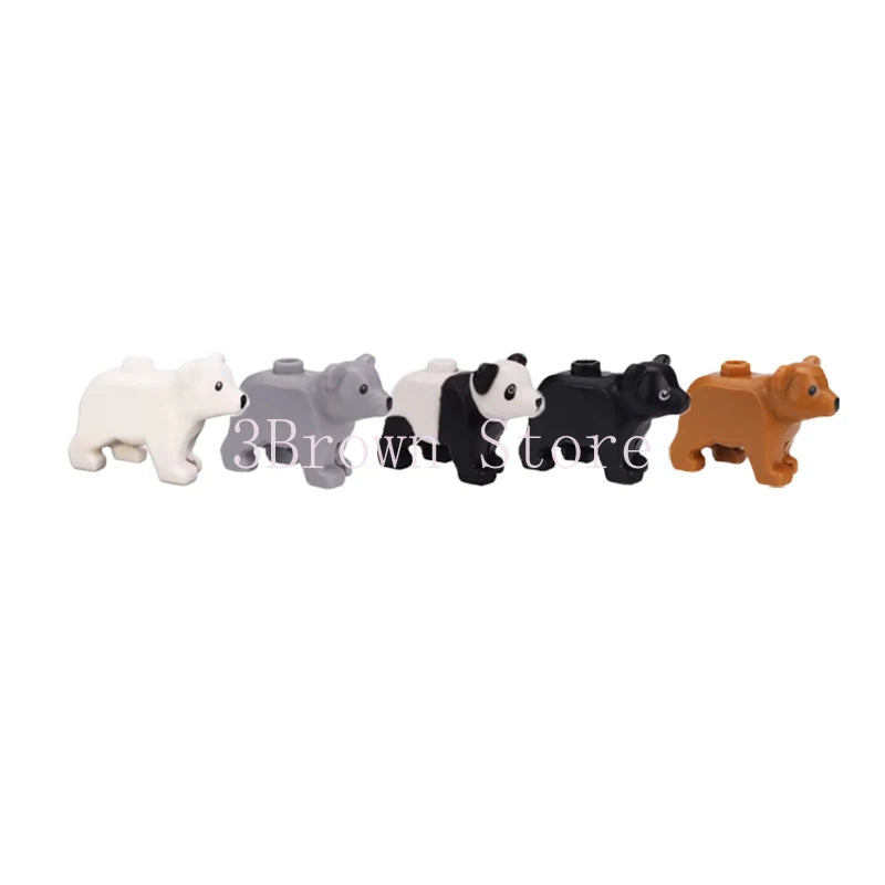 A set of six African wildlife animal building blocks in white, gray, black, and brown colors.