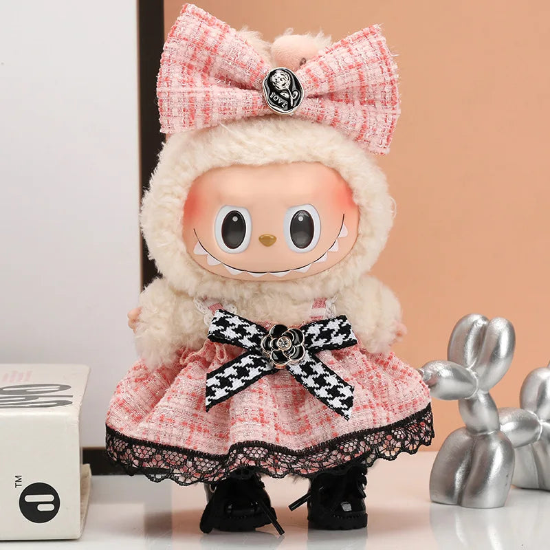 A plush Labubu doll wearing a pink plaid outfit with a white fluffy hood and black boots.