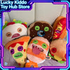 A collection of colorful monster plush toys including a yellow face, a brown monster, and an orange creature.