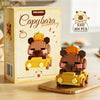 A box of K410 Capybara Bakery micro building blocks featuring a bear and a yellow car.