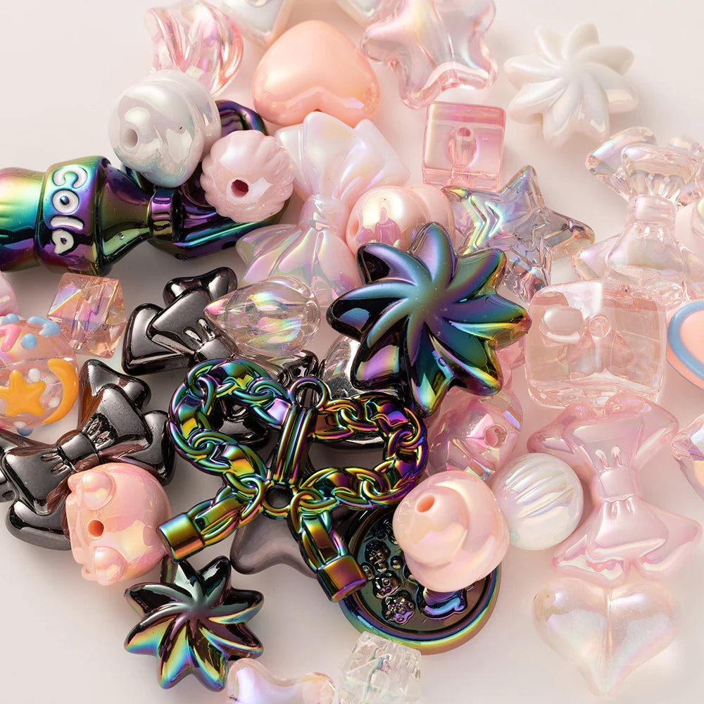 A collection of iridescent and pastel acrylic bow and flower beads for DIY jewelry making.