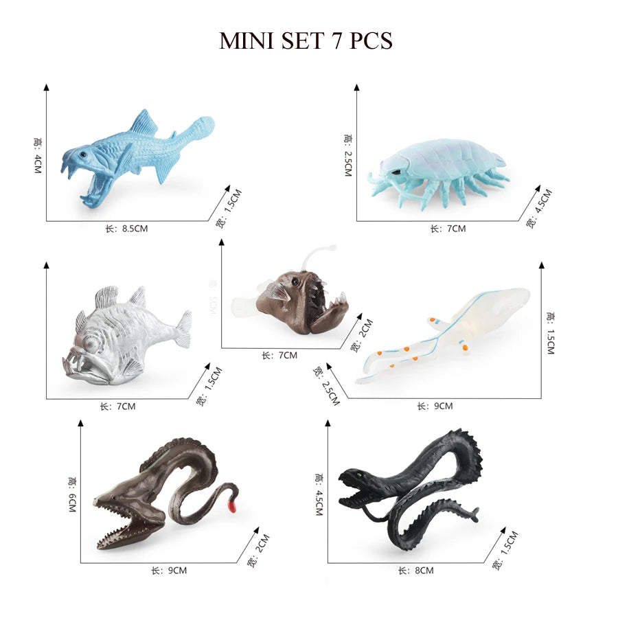 A mini set of seven realistic ocean animal figurines including a shark, whale, dolphin, turtle, and penguin.