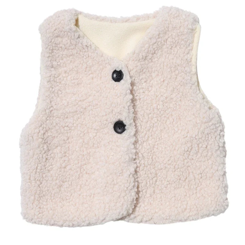 A cream-colored plush fleece vest for children, featuring a light beige lining and dark buttons.