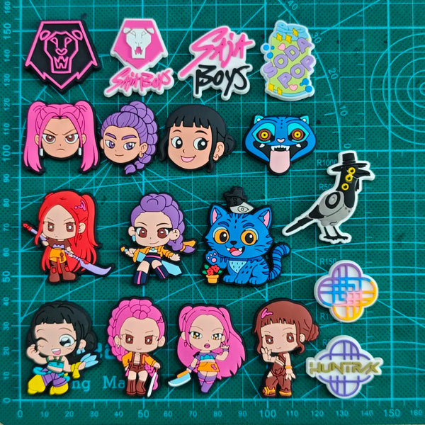 A collection of chibi cartoon character shoe charms featuring various anime and cartoon characters.