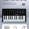 A black portable wireless MIDI keyboard featuring a full-sized keyboard, pads, and a rotary encoder.