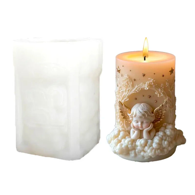 A lit candle in a decorative glass holder featuring an angel design with gold accents.