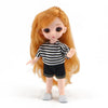 An orange-haired Articulated BJD princess doll wearing a black and white striped top and dark shorts.