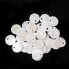 A collection of natural white shell beads in various round sizes and finishes.