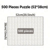 A box showing a 500 piece puzzle with dimensions of 52cm by 38cm.