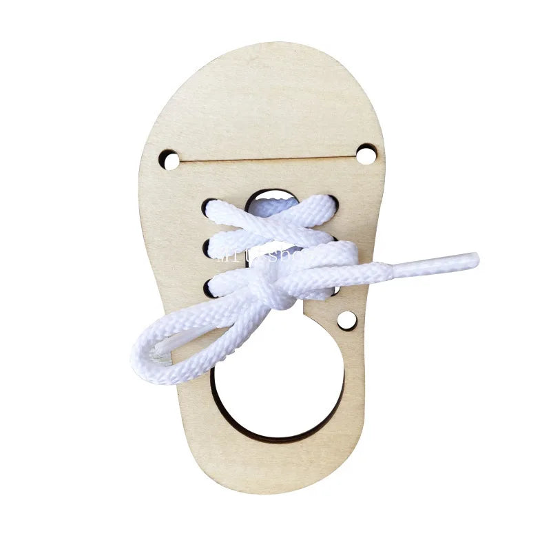 Montessori wooden busy board featuring castle and bulldozer themes with a white rope knot