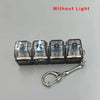 A set of four clear acrylic key buttons with a plus sign on them attached to a silver keychain.