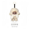 A collectible figure of Sandman with light brown fur and a round face, suspended by a black hook.