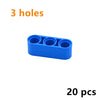 A blue Technic liftarm beam with three holes, sold as a 20-piece set of building blocks.