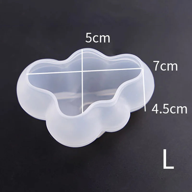 A translucent silicone mold with a cloud-shaped cavity and measurement lines showing dimensions up to 7cm.