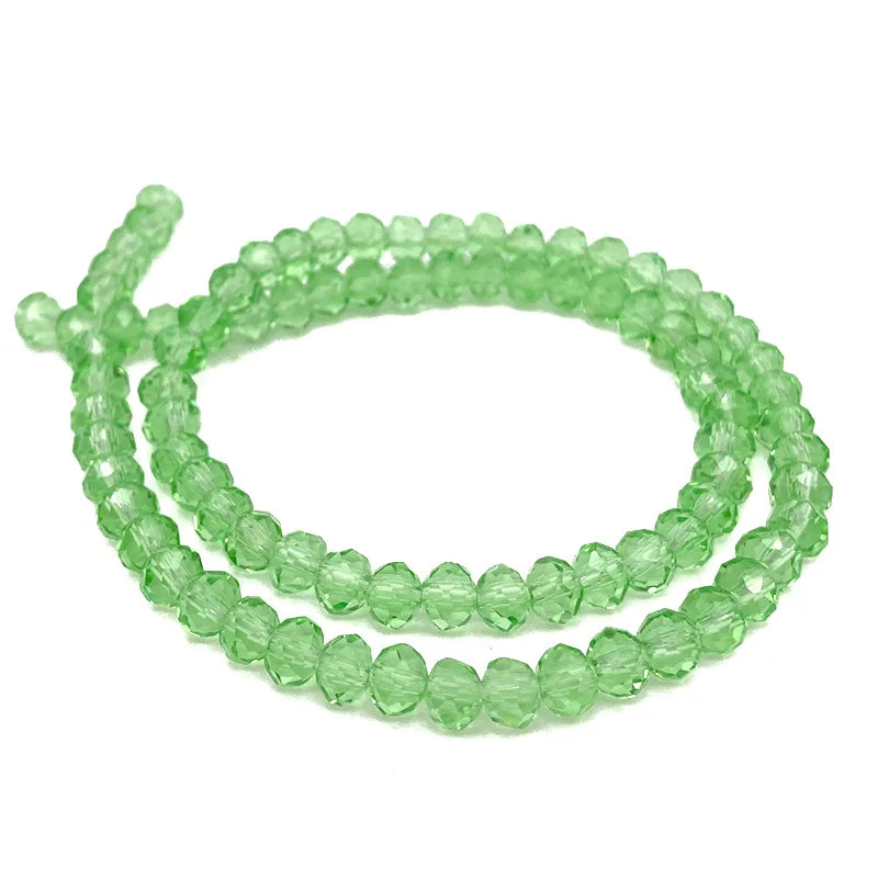 Green faceted crystal beads strung together for jewelry making