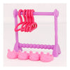 A pink doll laundry accessory set featuring a drying rack and pink plastic hangers and small pink cups.
