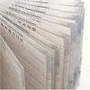 A stack of three reusable English italic handwriting practice copybooks with various examples visible.
