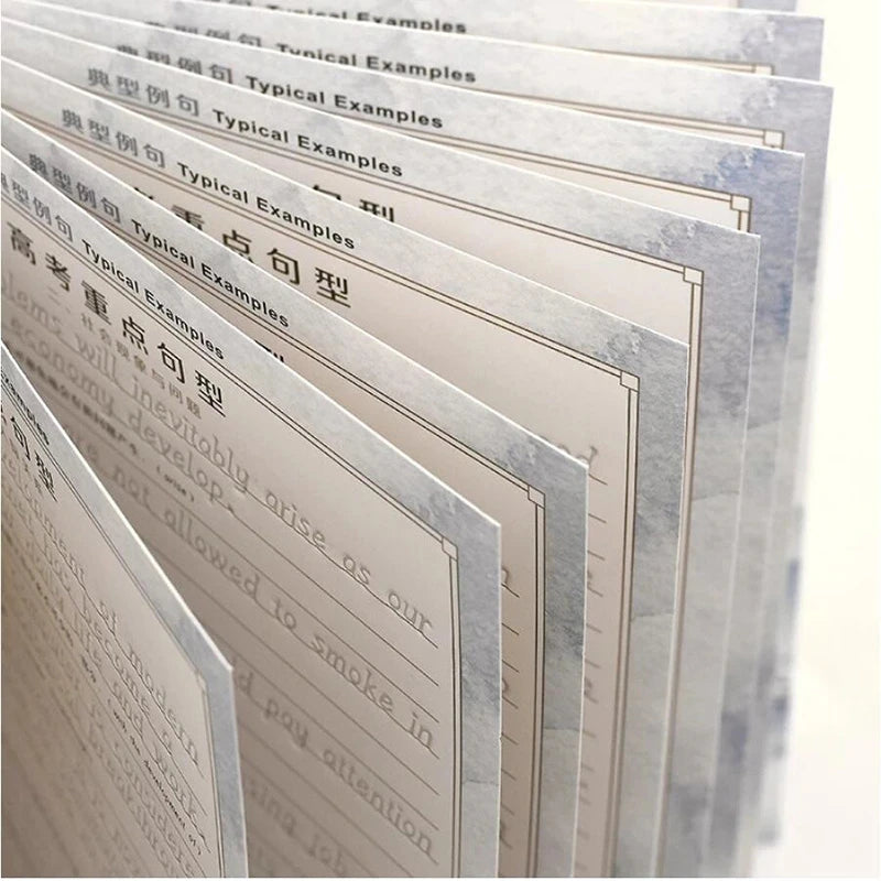 A stack of three reusable English italic handwriting practice copybooks with various examples visible.
