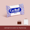 A purple and white bag of La Doll premix lightweight stone plastic clay 120g in a blue bag.